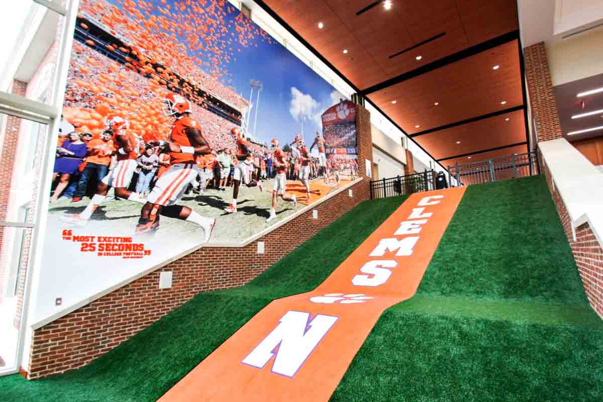 hallway with turf flooring and celebration wall mural for Clemson