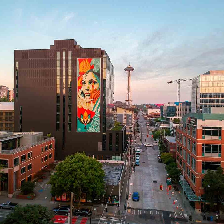 cityscape with large format printing mural by Shepard Fairey